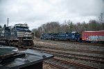 Parking boxcars backgrounds the mainline traffic